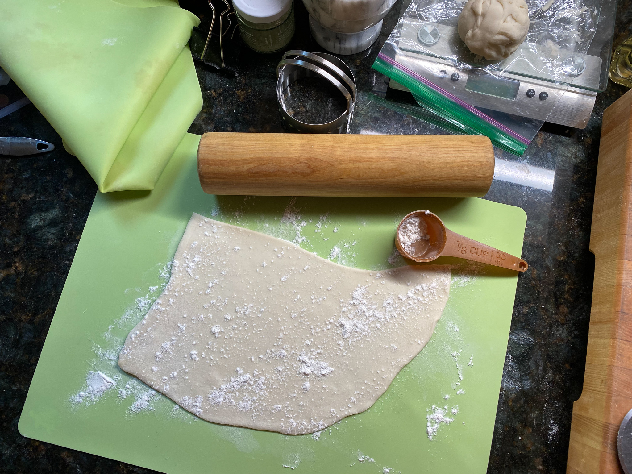 rolling out dumpling dough for vegetarian dumplings