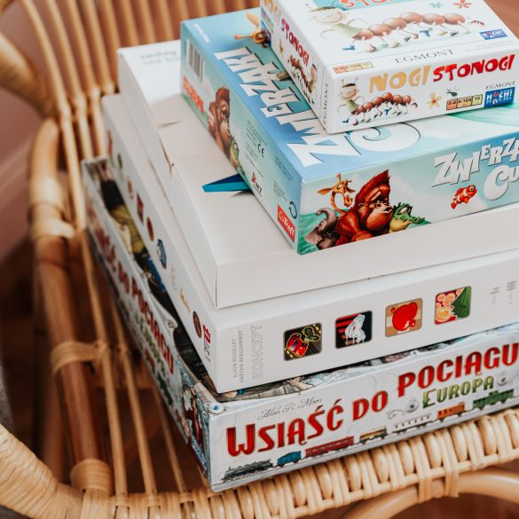 board games stacked for a thrifty date night idea 